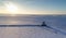 Drone shot of a frozen Lake Erie and the Lorain Lighthouse