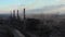 Drone shot of industrial city, factory tubes chimney smoke pollution