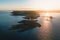 Drone shot of a lighthouse and islets at sunset, Swansea, UK