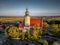 Drone shot of the old catholic church in Chrzaszczyce, Opole Voivodeship, Poland