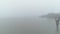 Drone shot over foggy lake