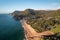 Drone shot over green Stanwell park beach on a sunny day