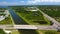 Drone shot of a river flowing to the Lake Tarpon Canal and the Oldsmar Trail Head in Florida, USA