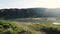 Drone shot of river and mountains at sunset in Kazakhstan