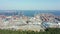 Drone shot at a sea port with containers and a container ship.