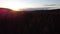 Drone shot of the sunset over a coniferous forest and llake Oulujarvi in central Finland`s Kainuu region. Autumn Finnish nature. E