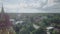 drone shot of the tall buddha statue sitting inside a religious building by the country road