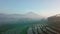 Drone shot of the terraced Rice fields in the morning which being planted with paddy plants in the tropics