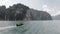 Drone shot of Thailand national boat on the lake with mountains