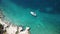 Drone shot of a white yacht sailing off the coast of Turkey.