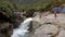 Drone Shows Attractive Young Girls Taking Photo on Large Rock