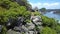 Drone Shows Happy Athletic Girl Waving Hands among Steep Cliffs