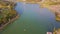 Drone shows panoramic view wide lake among green park
