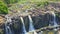 Drone Shows Waterfalls Stream River against Jungle in Vietnam