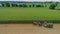 Drone Side View of Amish Harvesting Their Corn Using Six Horses and Three Men as Done Years Ago