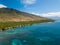 Drone side view of the dry mountains and crystal clear waters of the Lahaina Coast on the island of Maui, Hawaii