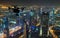 Drone silhouette flying above Dubaicity panorama