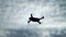 Drone Silhouette Flying on Cloudy Sky
