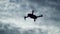 Drone Silhouette Flying on Cloudy Sky