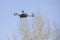 drone on sky background. Radio-controlled quadrocopter is filming nature. Unmanned flying toys