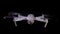Drone spinning propellers on black background