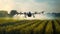 Drone spraying fertilizer over green field, modern agriculture