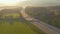 DRONE: Sunrise illuminates commuters driving up and down a country motorway.