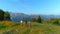 DRONE: Three mountain bikers stop and observe the picturesque morning landscape.