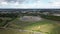 Drone time-lapse view of a townscape surrounded by nature