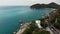 Drone top view. Huge stone on seashore. Main asphalt road going near large Elephant Rock on shore of turquoise sea on Ko Samui