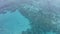 Drone, tropical water and sea from above with coral reef and ocean by an island vacation. Travel, holiday and beach with