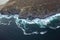 drone turquoise waters ocean rocks sky