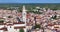 Drone video of the historic Croatian town of Voznjan in Istria with church bell tower