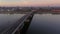 Drone video over the Rhine and Mainz waterfront with Theodor Heuss Bridge in the morning during sunrise