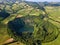 Drone view of amazing lagoon. Lake formed by the crater of an old volcano in San Miguel island, Azores, Portugal. Bird eye view, a