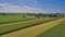 Drone View of Amish Countryside With Barns and Silos and Corn, Patch Work of Color and Corps