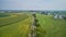 Drone View of Amish Countryside With Barns and Silos and a Single Railroad Track Traveling Through It