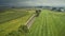 Drone View of Amish Countryside With Barns and Silos and a Single Railroad Track Traveling Through It