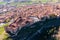 Drone view of ancient castle above residential areas in Siguenza