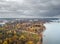 Drone view of autumn suburban parks of St. Petersburg with palaces on the shores of the Gulf of Finland on a cloudy day