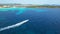 Drone view of a Banana boat ride in Sa Coma beach in Mallorca, Spain on a summer day