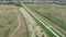 Drone view of beautiful river with promenade. Incredible nature landscape, drone shot. Cycle path and foot path along river from b