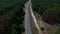 Drone view bicyclists group riding at countryside highway on bike ride