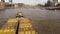 A drone view of a boat on the Thames that drags cargo barges.