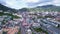 Drone view of the city of Patong, Phuket island Thailand, Houses of different heights. Green hills of the island and many cars on