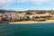 Drone view of coastal Spanish town of Arenys de Mar with sandy beach