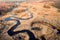 Drone view of curved river at springtime