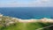 Drone view of Cyprus green valley on Mediterranean Sea coastline. Aerial wide shot of deserted sandy beach and calm