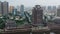 Drone view of the Dongpo Urban Wetland Park with modern buildings behind it, Meishan city, China