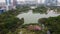 Drone view, evening time flight over Foshan city famous Lakeside downtown park, Qiandeng Lake, China
